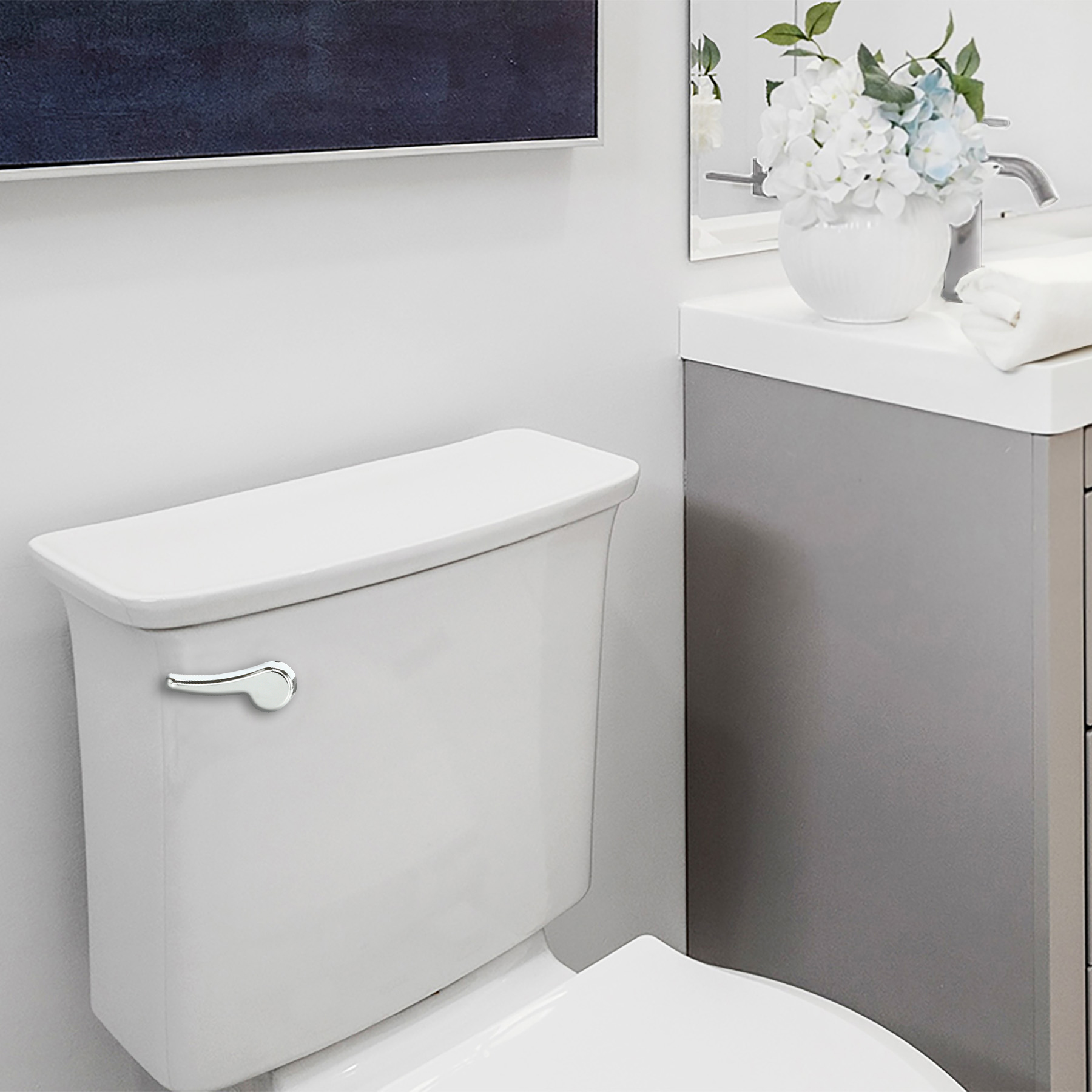 bathroom featuring the korky chrome toilet flush handle