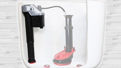 this image contains a fill valve inside a toilet tank